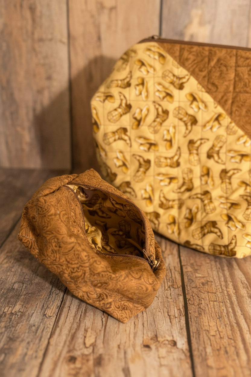 A close-up of a small brown fabric pouch with an embossed pattern, shown next to a larger matching fabric item with a repeating boot motif on a light surface.